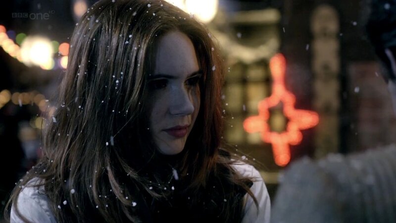 woman in snow at night