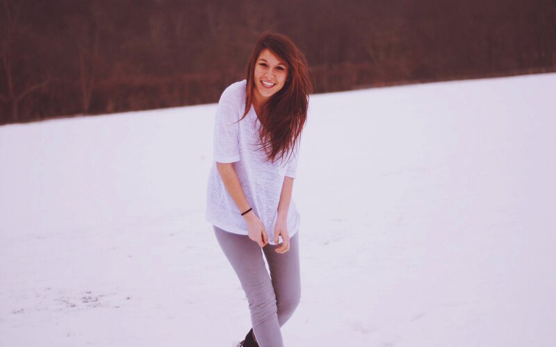 woman in snow smiling