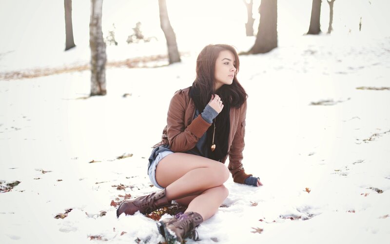 woman in snow wearing boots