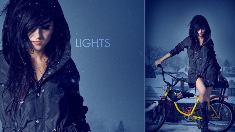 woman in snow with bicycle
