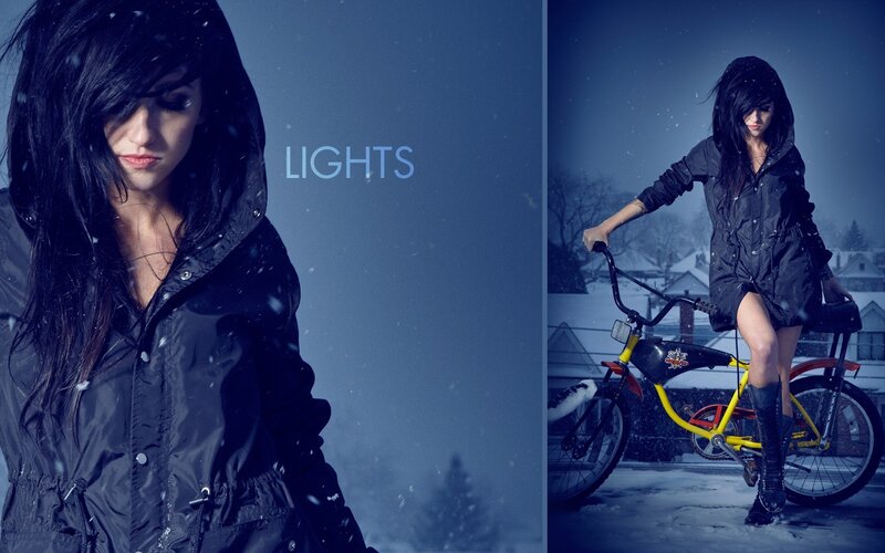 woman in snow with bicycle