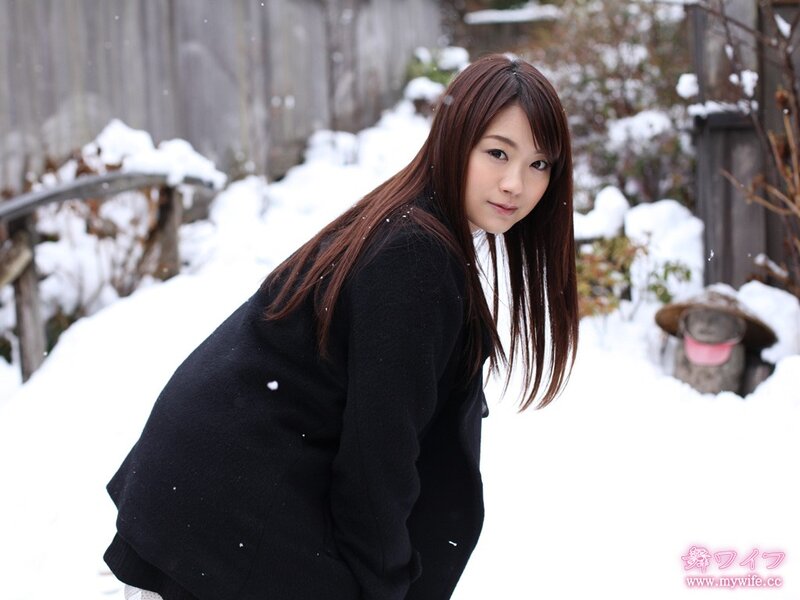 woman in snow with black coat