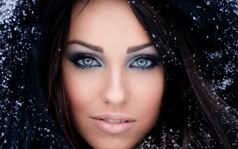woman in snow with blue eyes