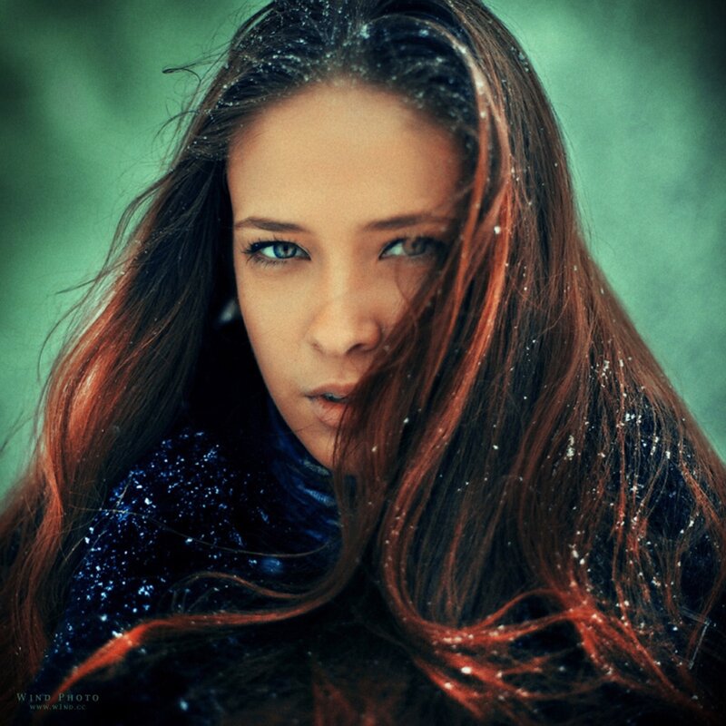 woman in snow with blue eyes