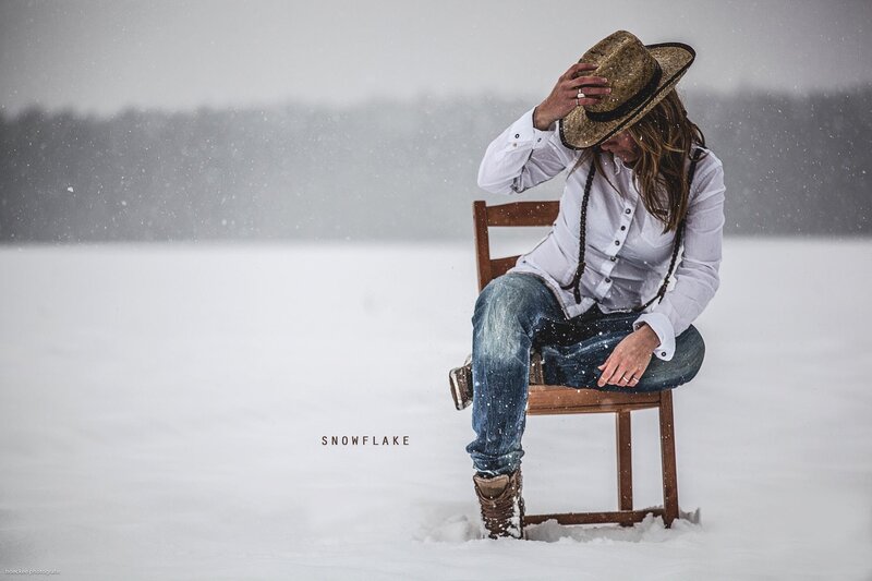 Woman in snow with cowboy hat