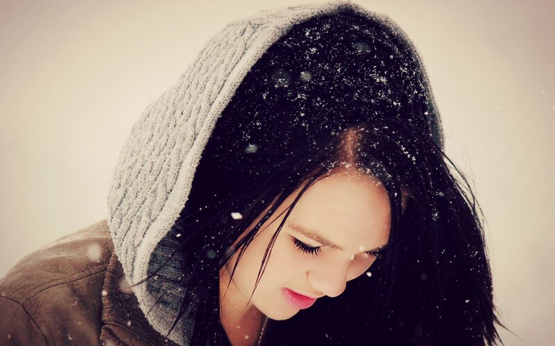 woman in snow with hood