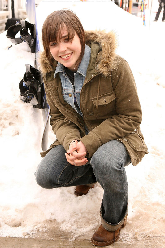woman in snow with snowboard