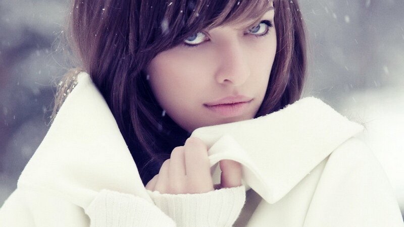 woman in snow with white coat