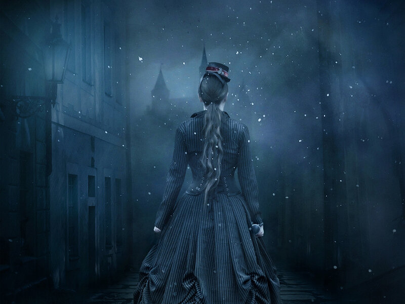 woman in snowstorm at night