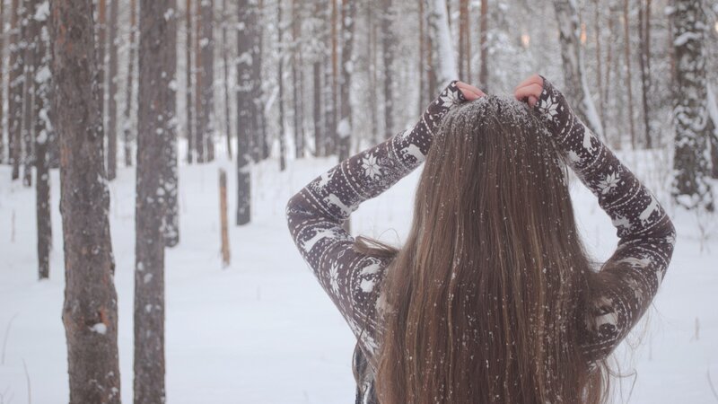 woman in snowy forest