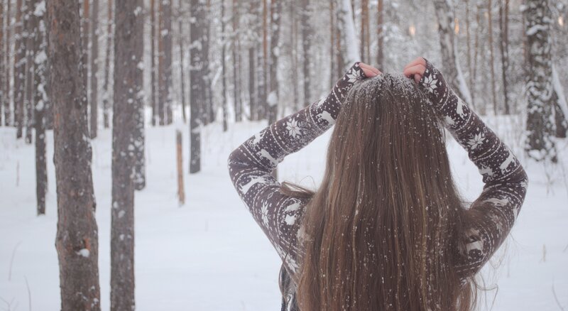 woman in snowy forest