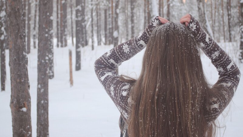 woman in snowy forest