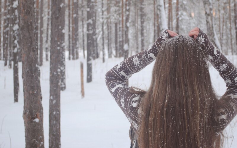 woman in snowy forest