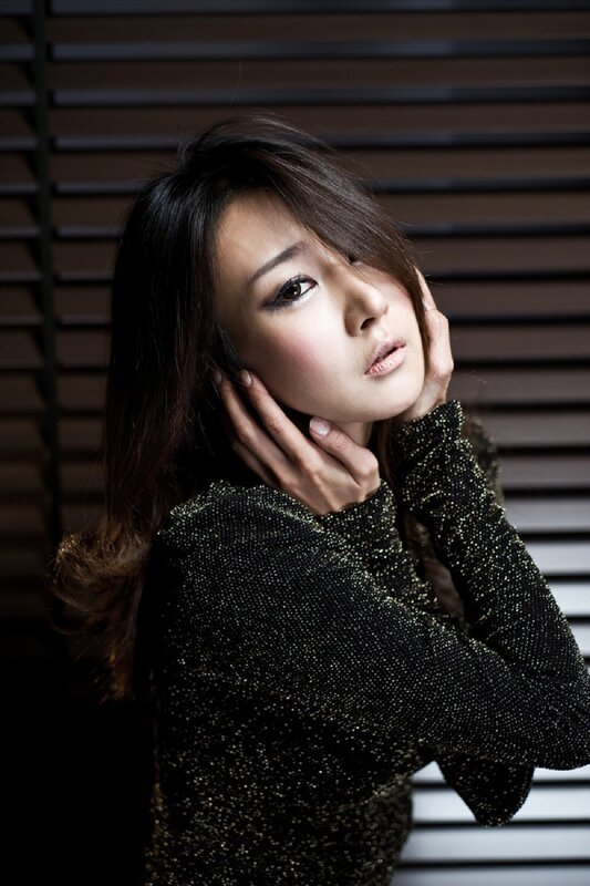 woman in sparkly black top