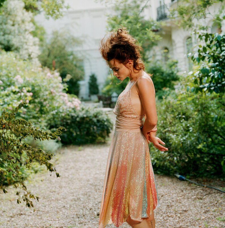 Woman in sparkly dress in garden