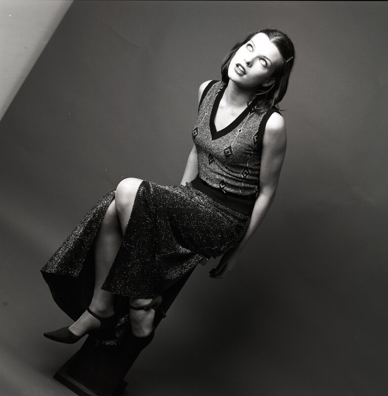 woman in sparkly dress sitting