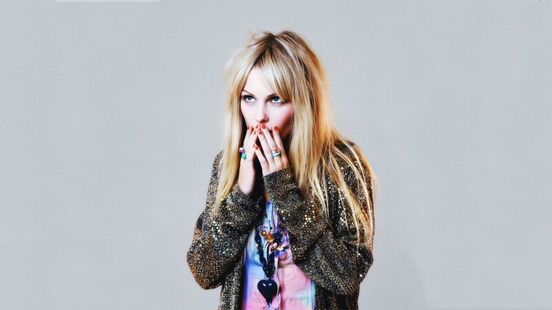 woman in sparkly jacket