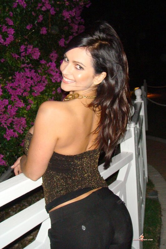 woman in sparkly top at night