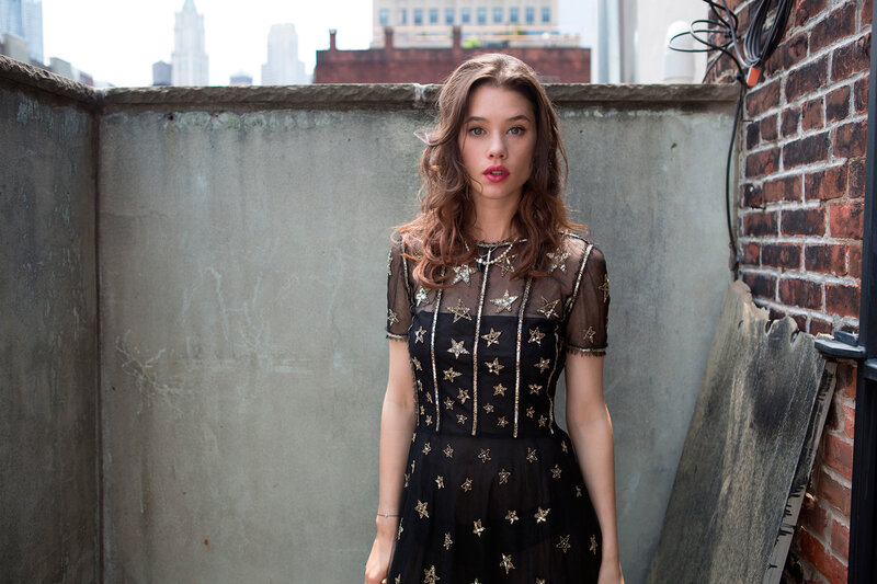 woman in star dress on rooftop