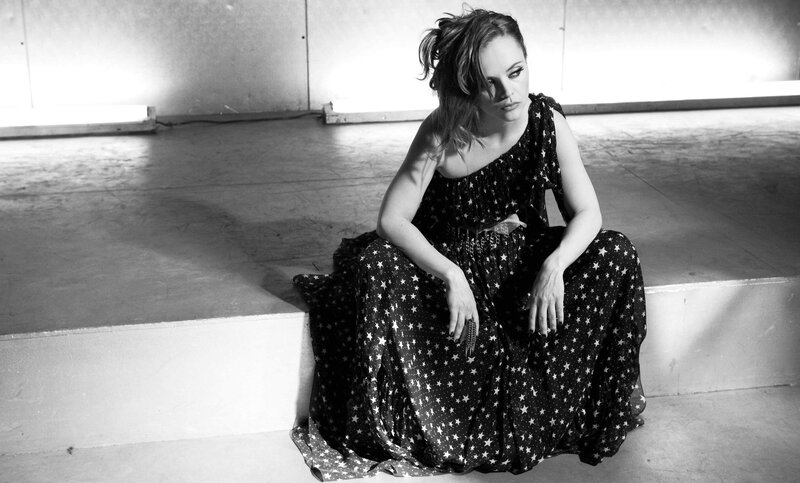 woman in star dress sitting