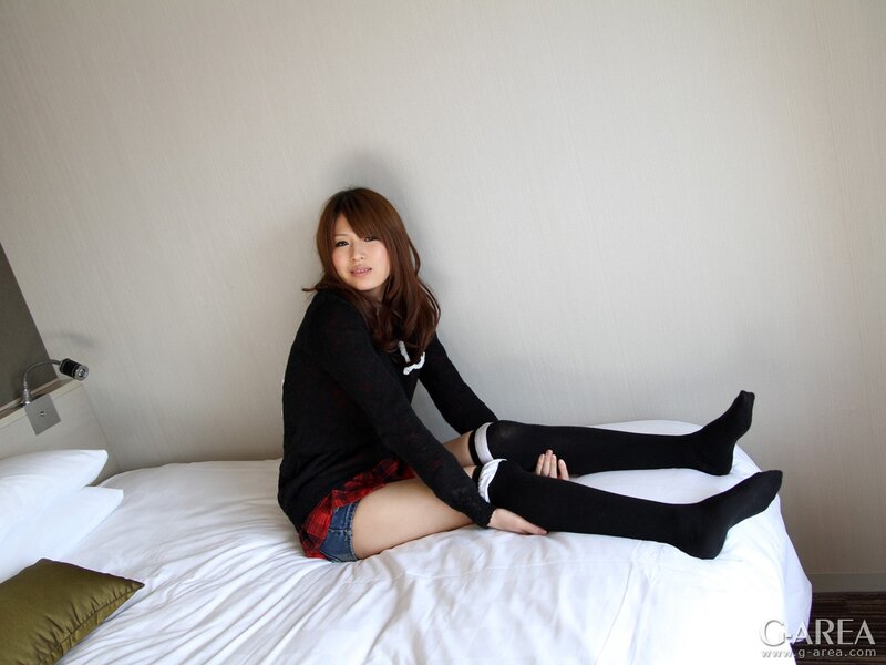 woman in stockings on bed