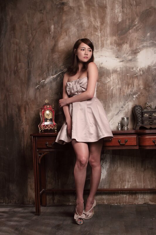 Woman in strapless dress posing