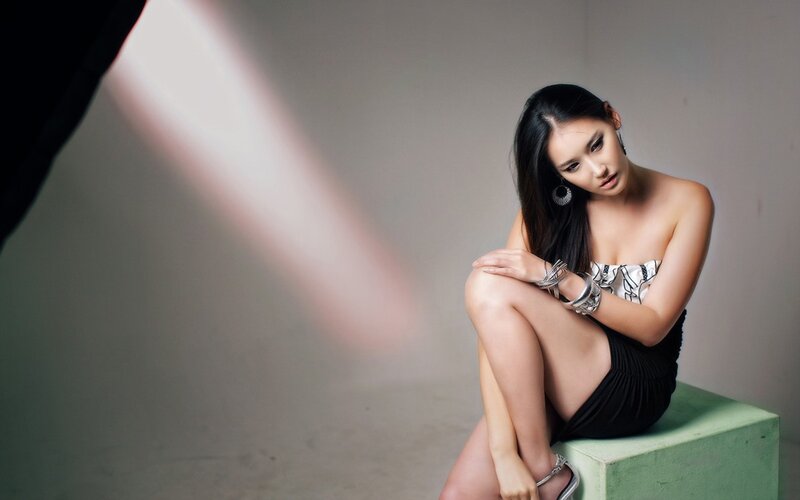 woman in strapless dress sitting