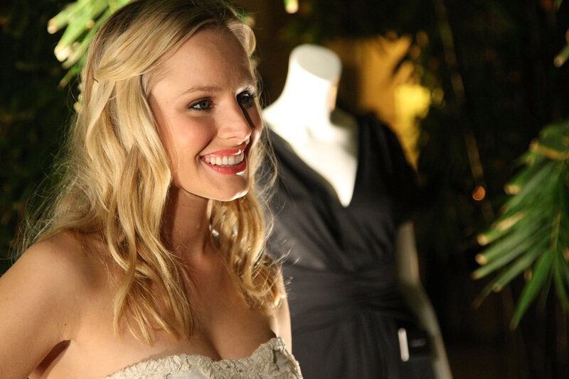 woman in strapless dress smiling