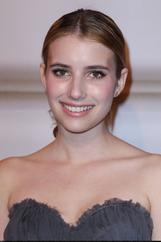 woman in strapless dress smiling