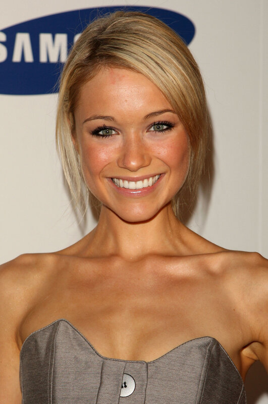 woman in strapless dress smiling