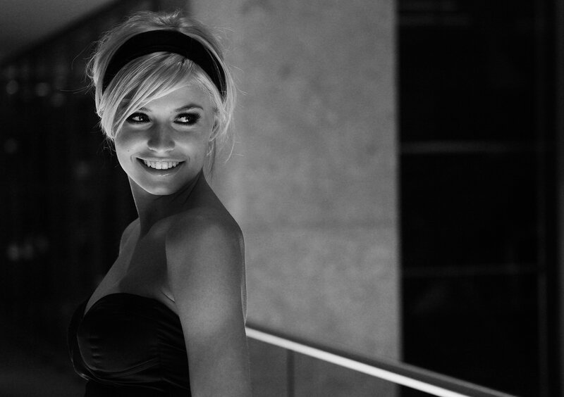 woman in strapless dress smiling