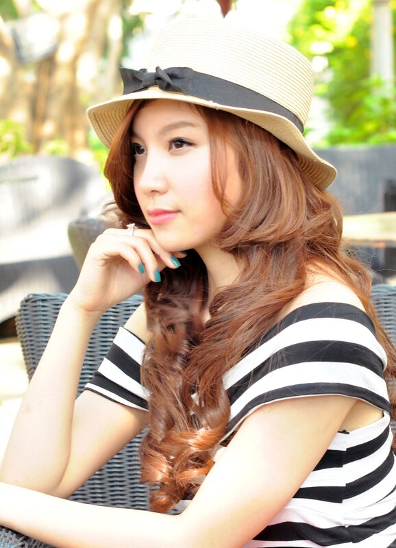 woman in straw hat and striped top