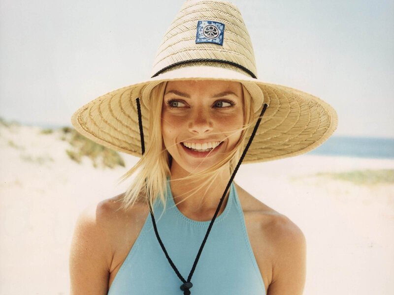 woman in straw hat at beach