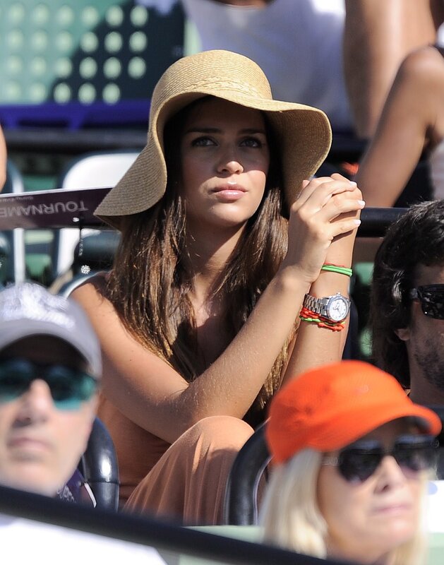 Woman in straw hat at event