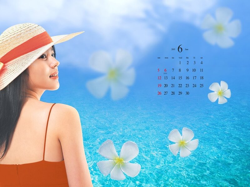Woman in straw hat by ocean