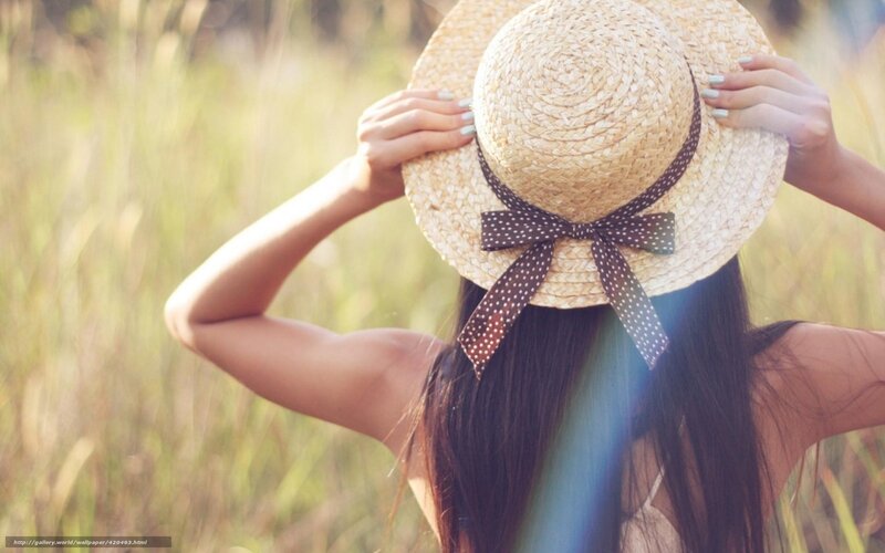 woman in straw hat in field