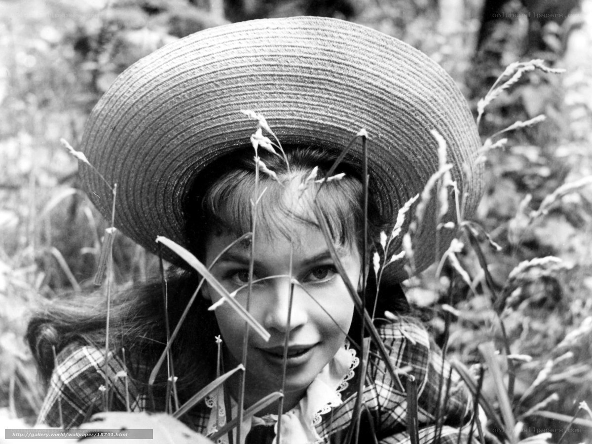 woman in straw hat in grass