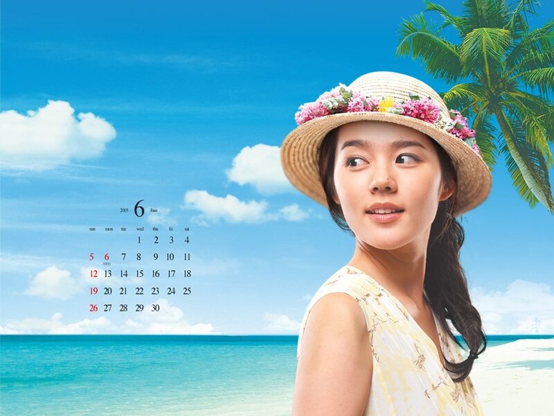 Woman in straw hat on beach