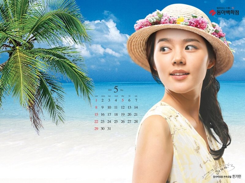 Woman in straw hat on beach