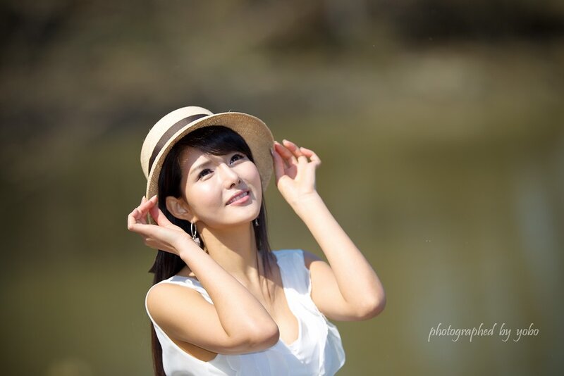 woman in straw hat outdoors