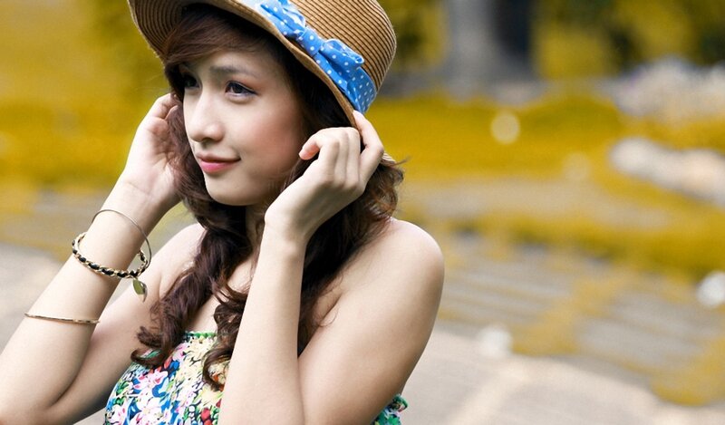 woman in straw hat outdoors