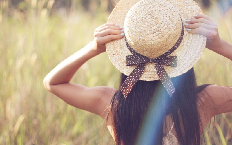 woman in straw hat outdoors
