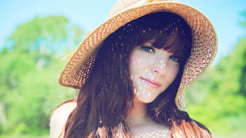 woman in straw hat outdoors