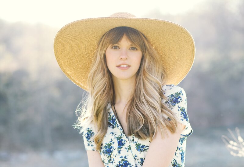 woman in straw hat outdoors