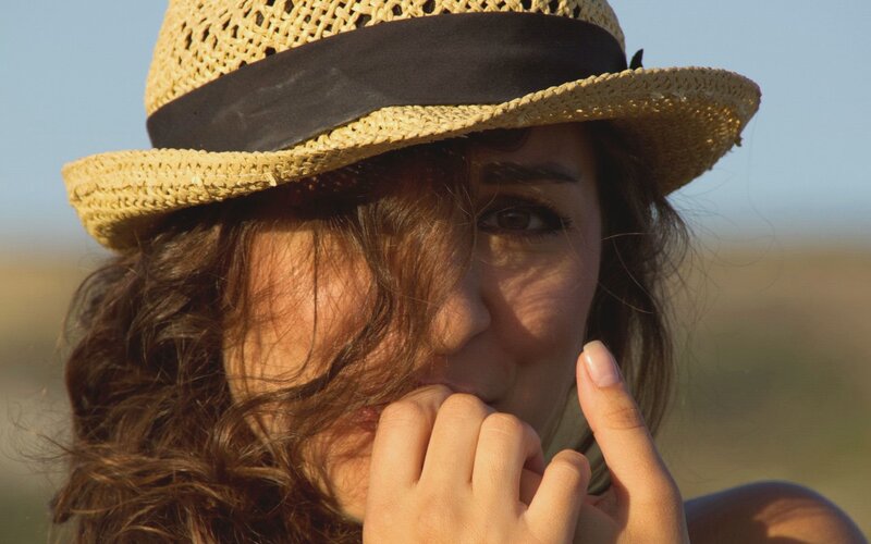 woman in straw hat outdoors