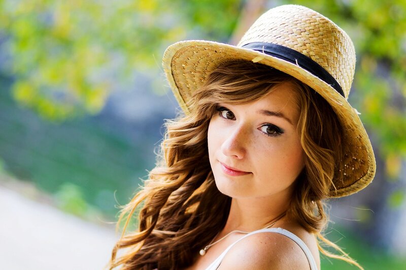 woman in straw hat outdoors