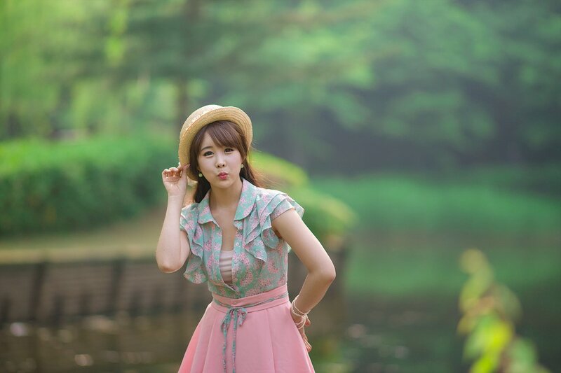 woman in straw hat outdoors