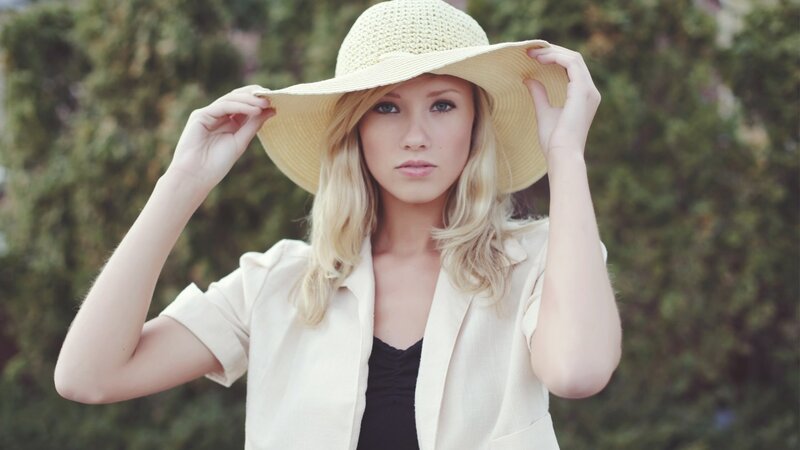 woman in straw hat outdoors