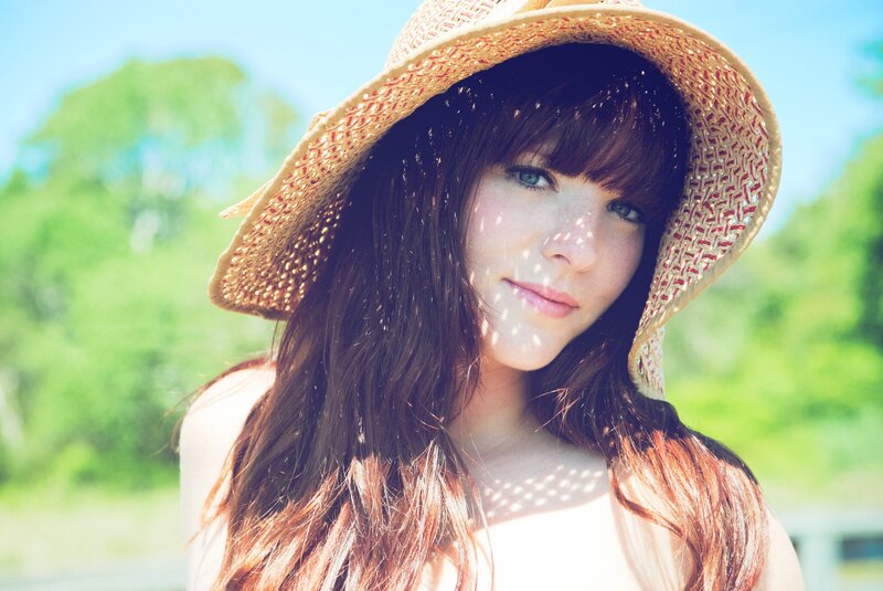 woman in straw hat outdoors