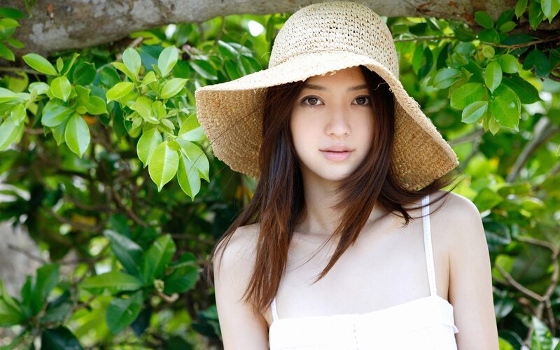 woman in straw hat outdoors